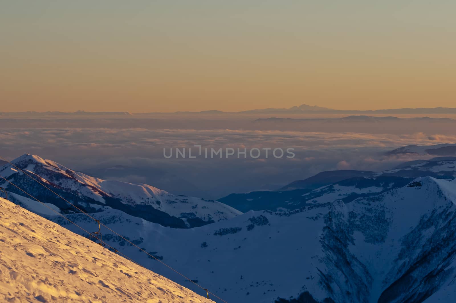 Snow peaks of the mountains in the evening