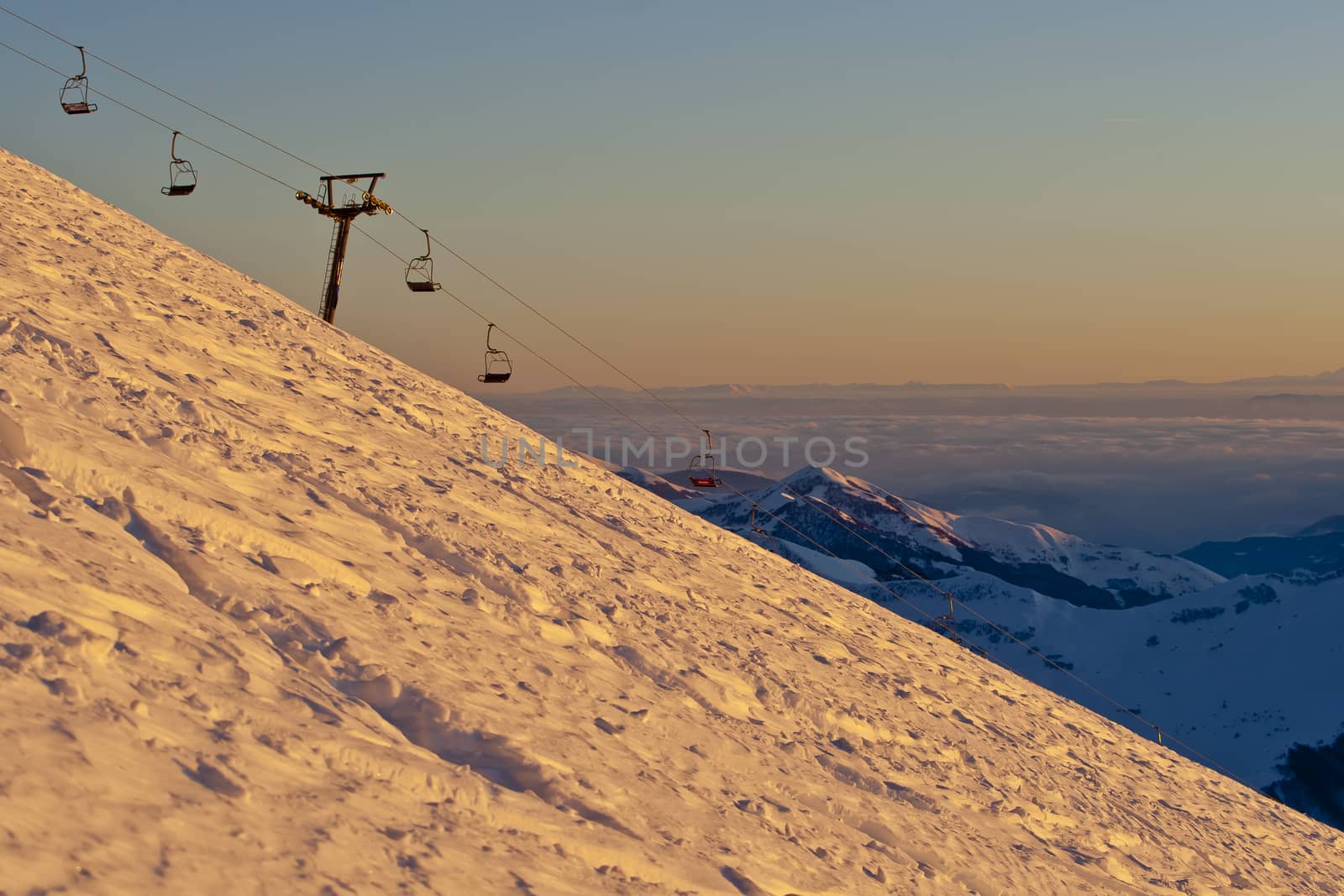 Snow peaks of the mountains in the evening