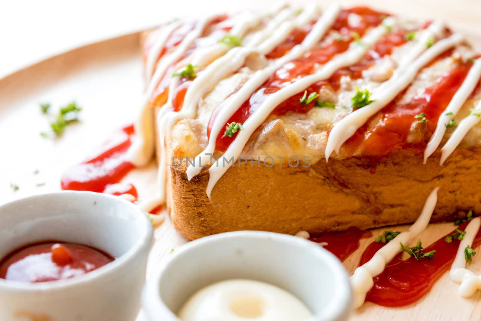 Pizza toasted bread with tomato sauce and ham cheese selective focus,