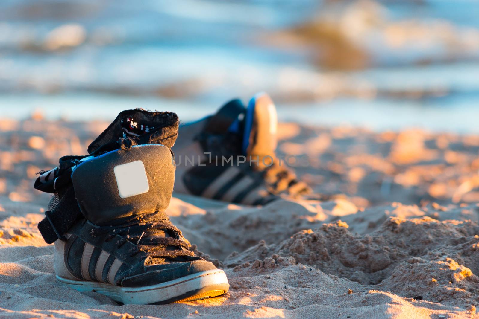 sneakers with sea wave on sand background by liwei12