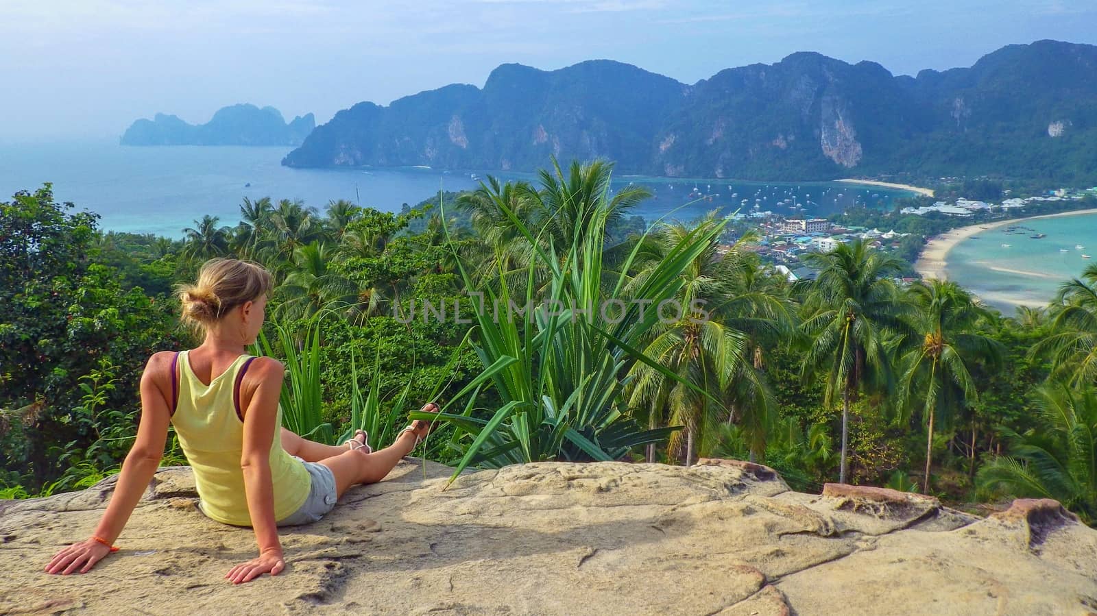 woman enjoys views of the sea. A relax on the seashore. Supervision over the horizon in Thailand, Phi  don island by evolutionnow