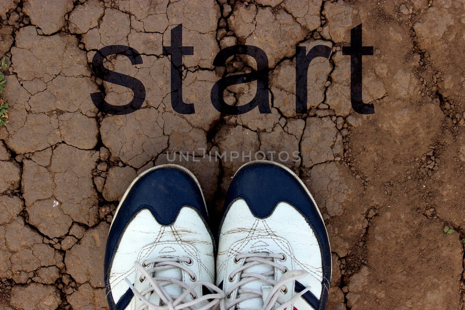 sneakers on dry cracked ground by liwei12