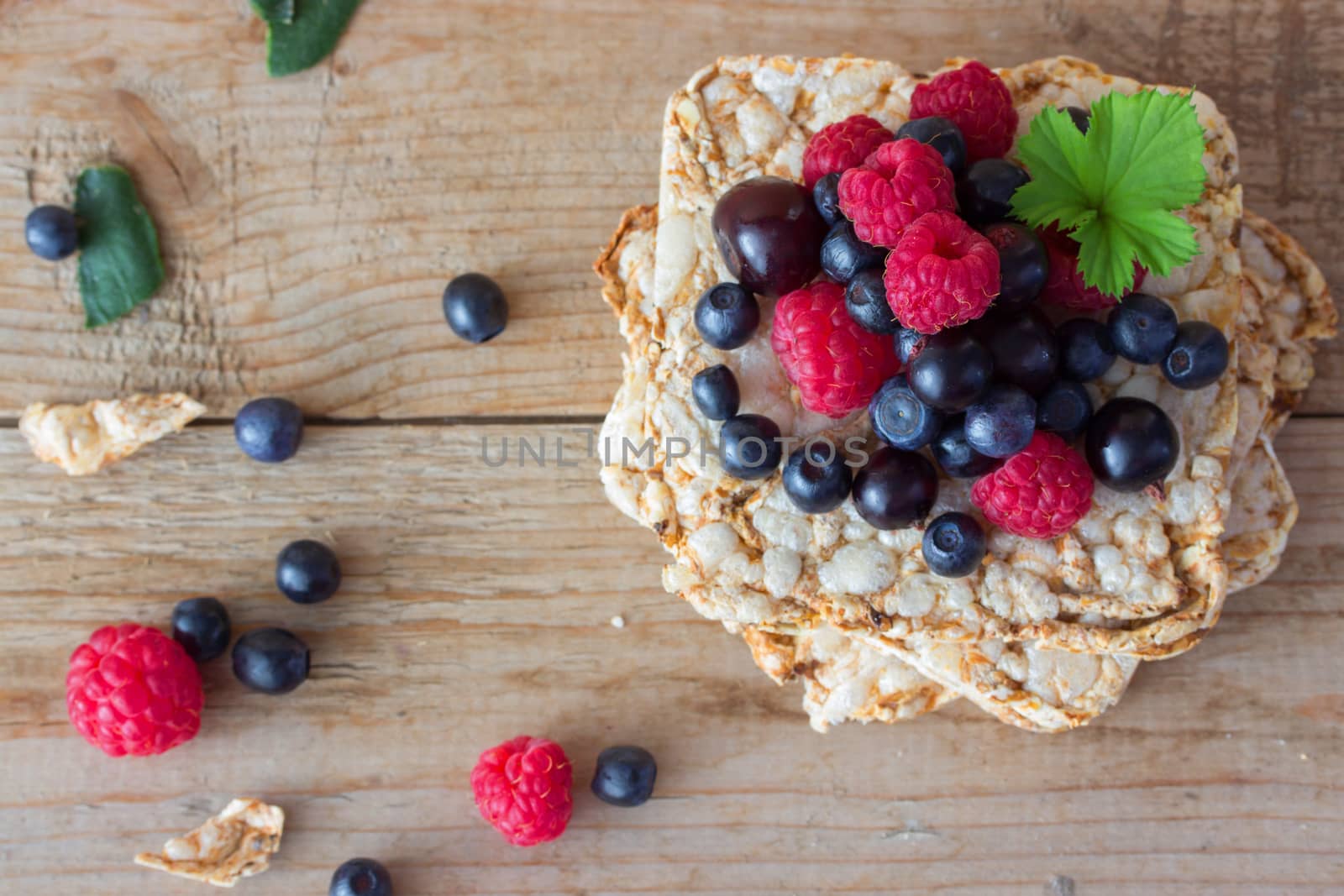 Bread topped with fresh fruit and mint leaf