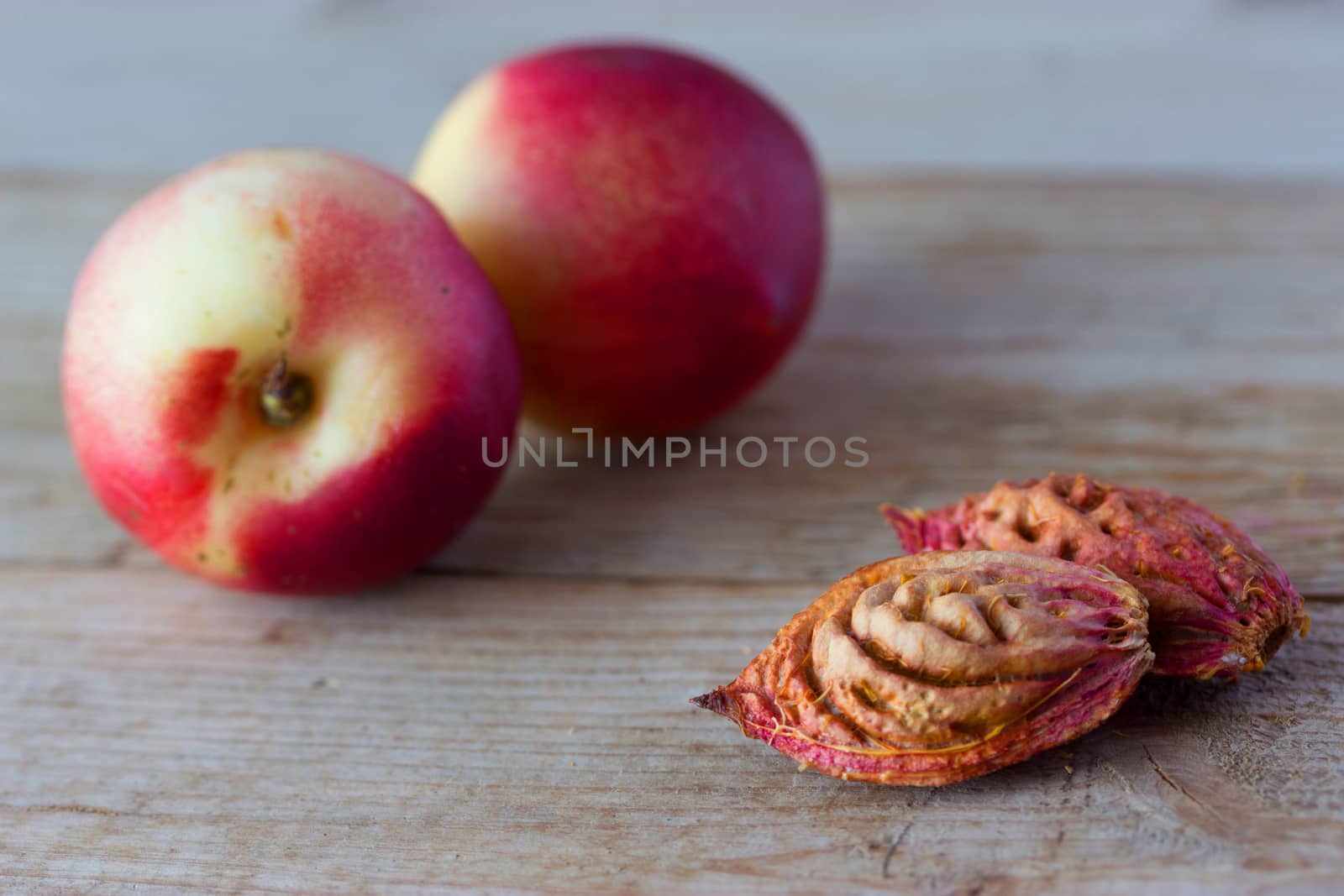 ripe peaches and pips n wooden background