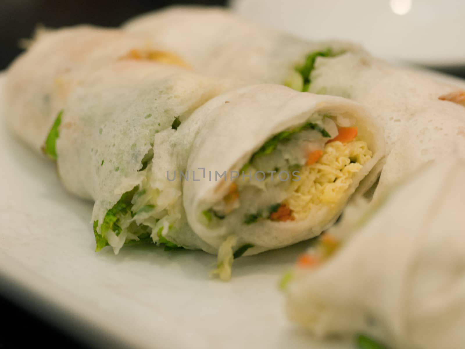 VEGETABLE SPRING ROLLS ON WHITE PLATE