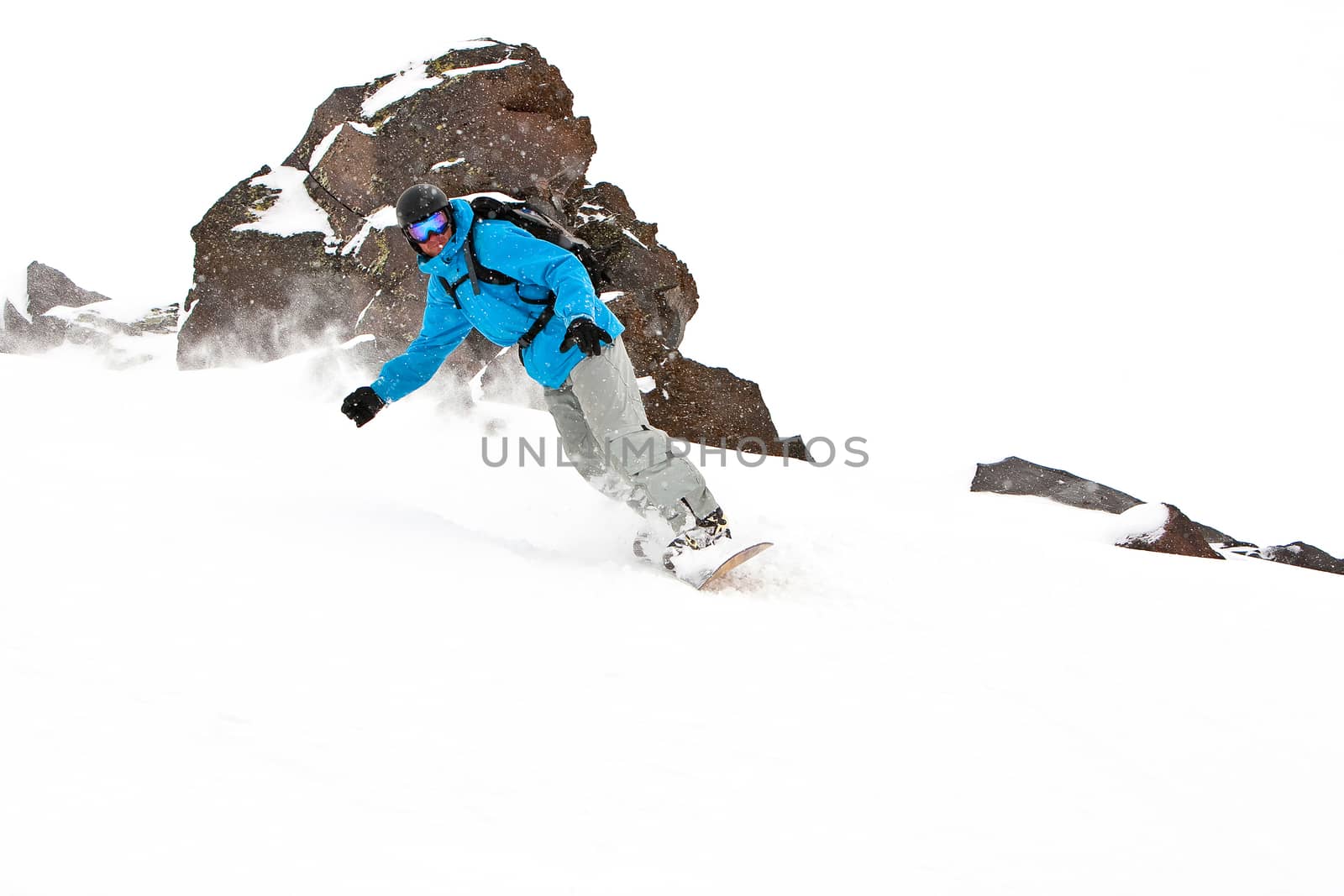 Snowboarder on a slope by Chudakov