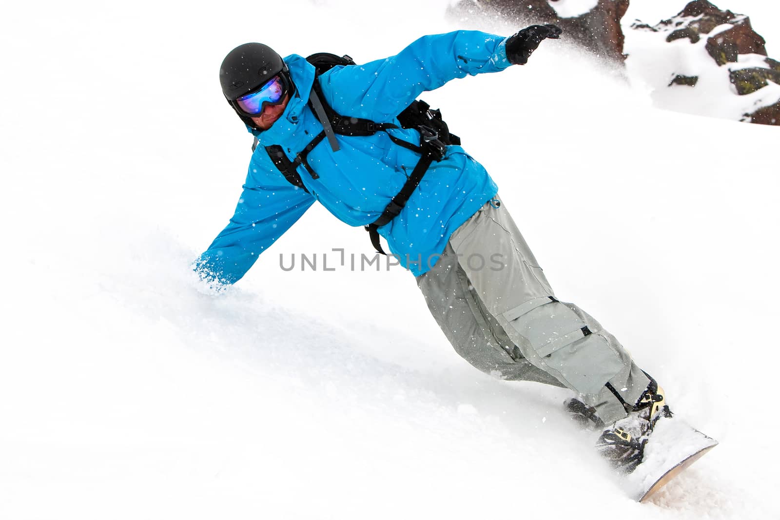 Snowboarder on a slope by Chudakov