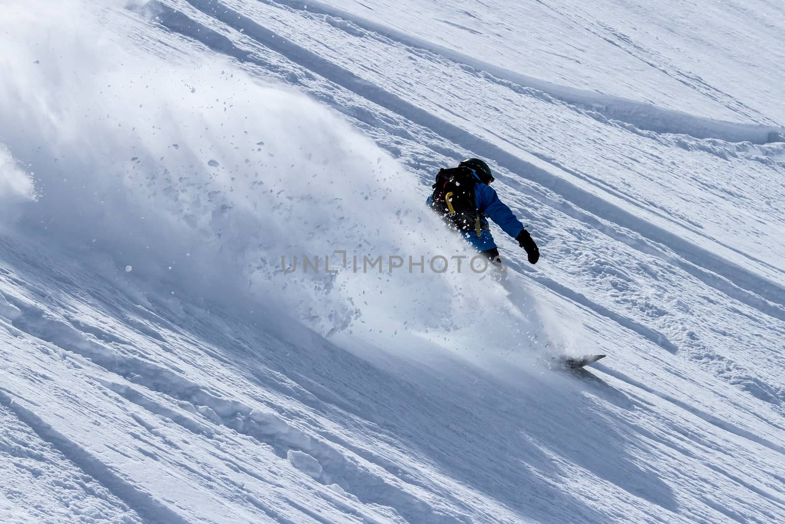 Freerider in snow powder in mountains of Kamchatka