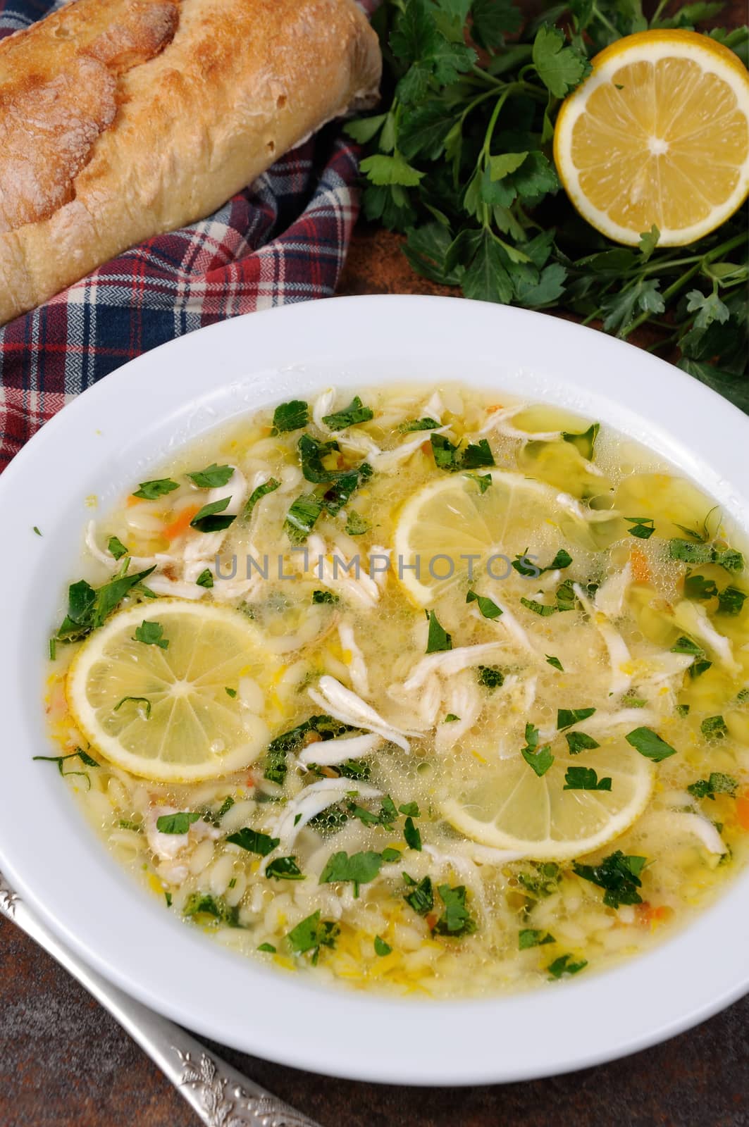 Avgolemono, greek   chicken soup with egg-lemon sauce, orzo and fresh parsley leaves
