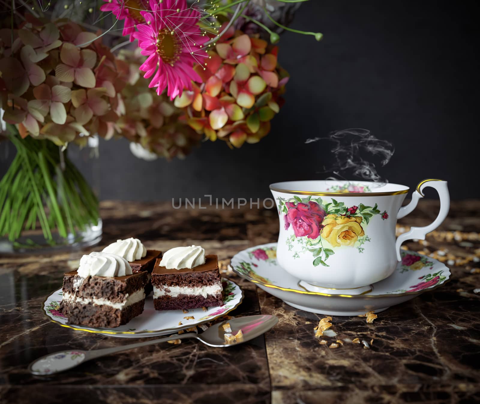 Closeup of cup of tea with cake and flowers bouquet on the wood table close up photo by denisgo