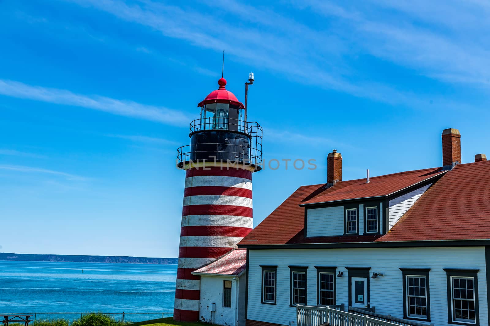 West Quoddy Head, in Quoddy Head State Park, Lubec, Maine, is the easternmost point of the contiguous United States. Since 1808, there has been a lighthouse there to guide ships through the Quoddy Narrows. The current one, with distinctive red-and-white stripes, was built in 1858, and is an active aid to navigation.