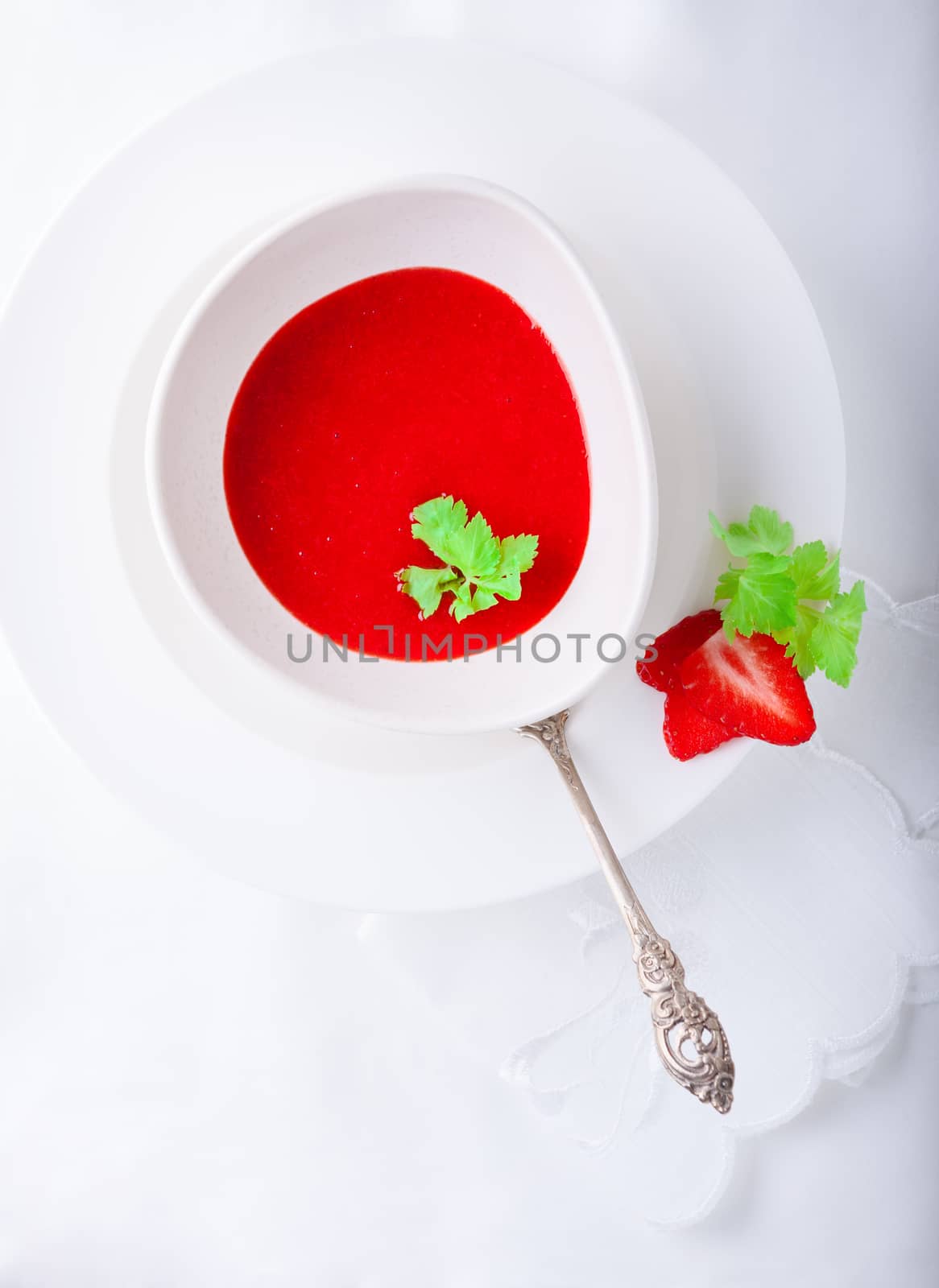 Strawberry soup with white napkin on a table. by supercat67