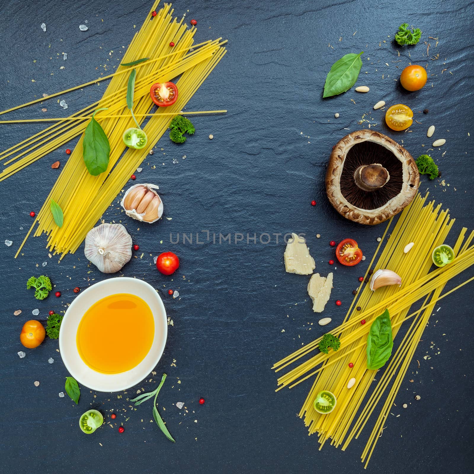 Italian food concept. Spaghetti with ingredients sweet basil ,tomato ,garlic peppercorn ,champignon,zucchini and parmesan cheese on dark background flat lay and copy space.