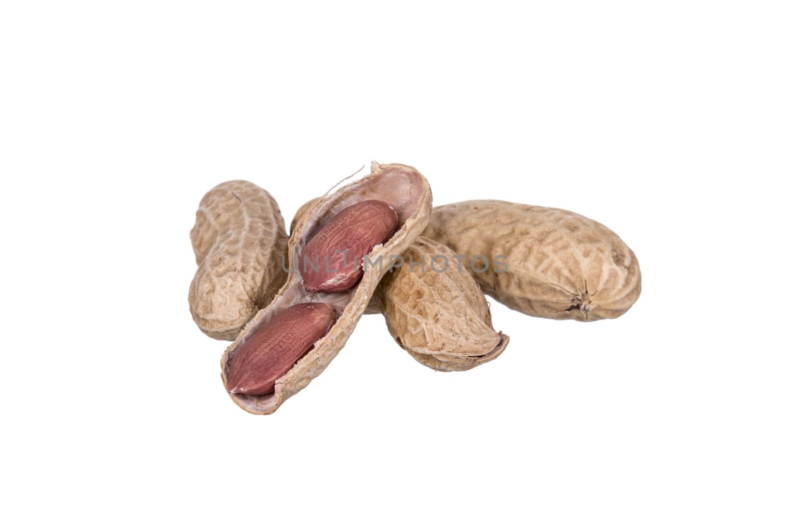 Peanuts dried in closeup isolated on white background.