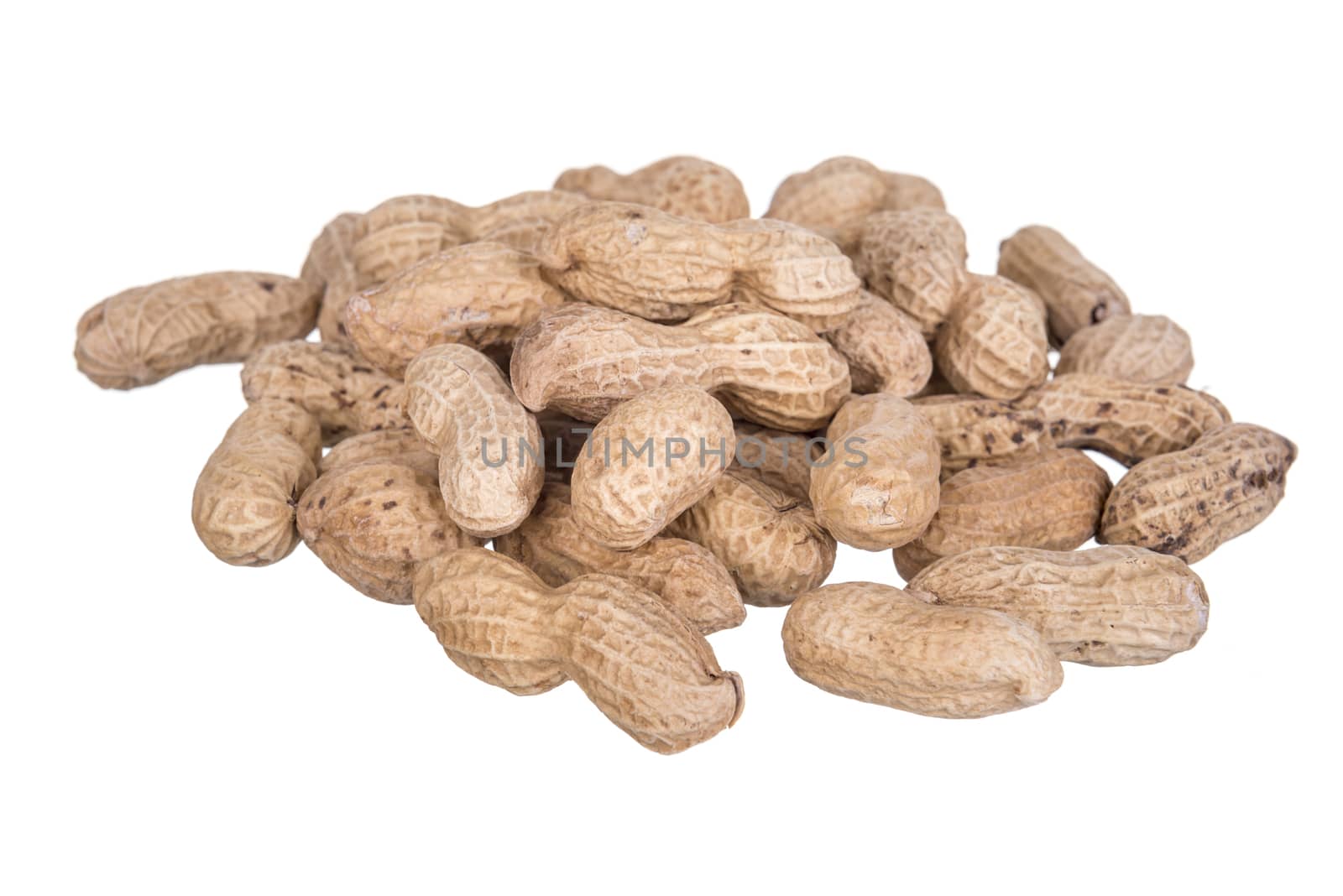 Peanuts dried in closeup isolated on white background.