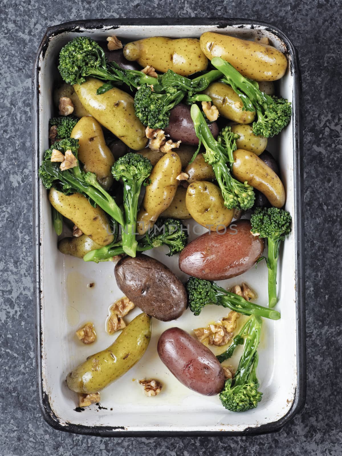 close up of a tray of potato broccolini salad