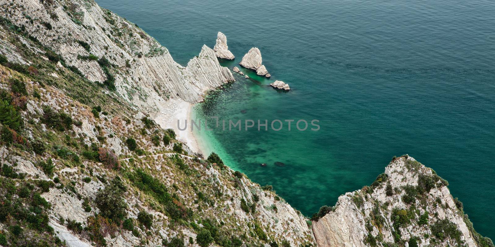 Beach of the two sisters seen from the wolf's step in the park of Mount Conero Italy