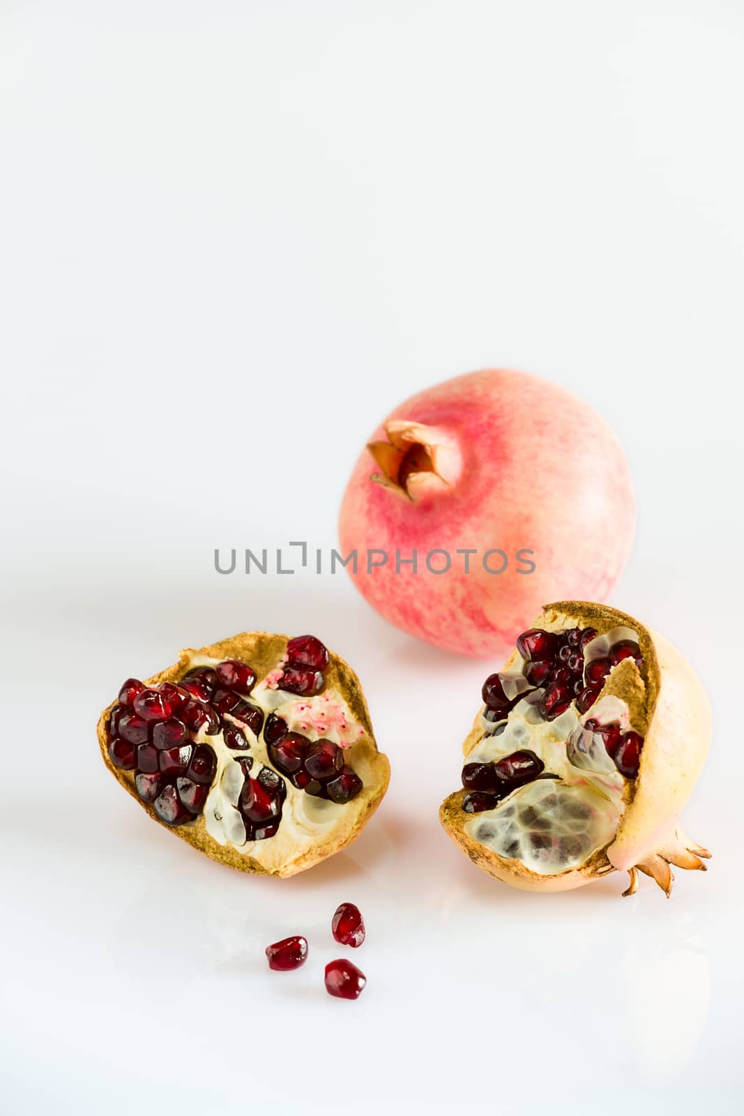 Ripe pomegranate fruit by LuigiMorbidelli