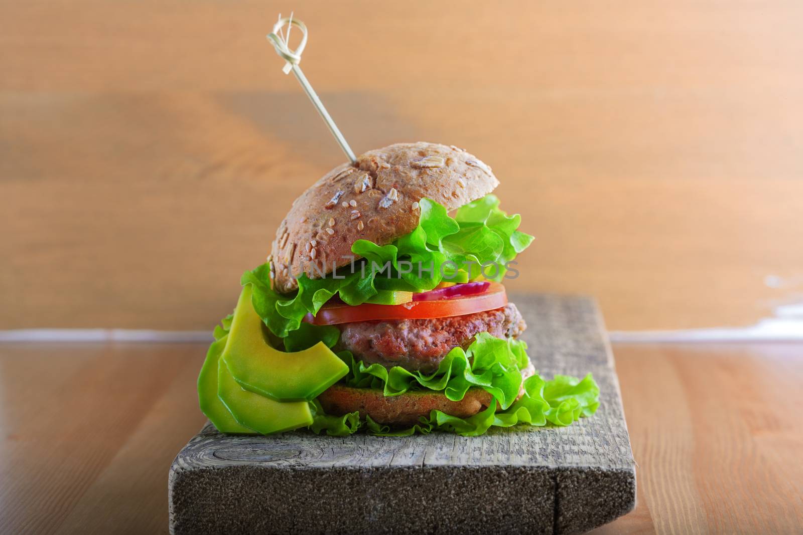 Delicious homemade burger on rustic wooden desk. by supercat67