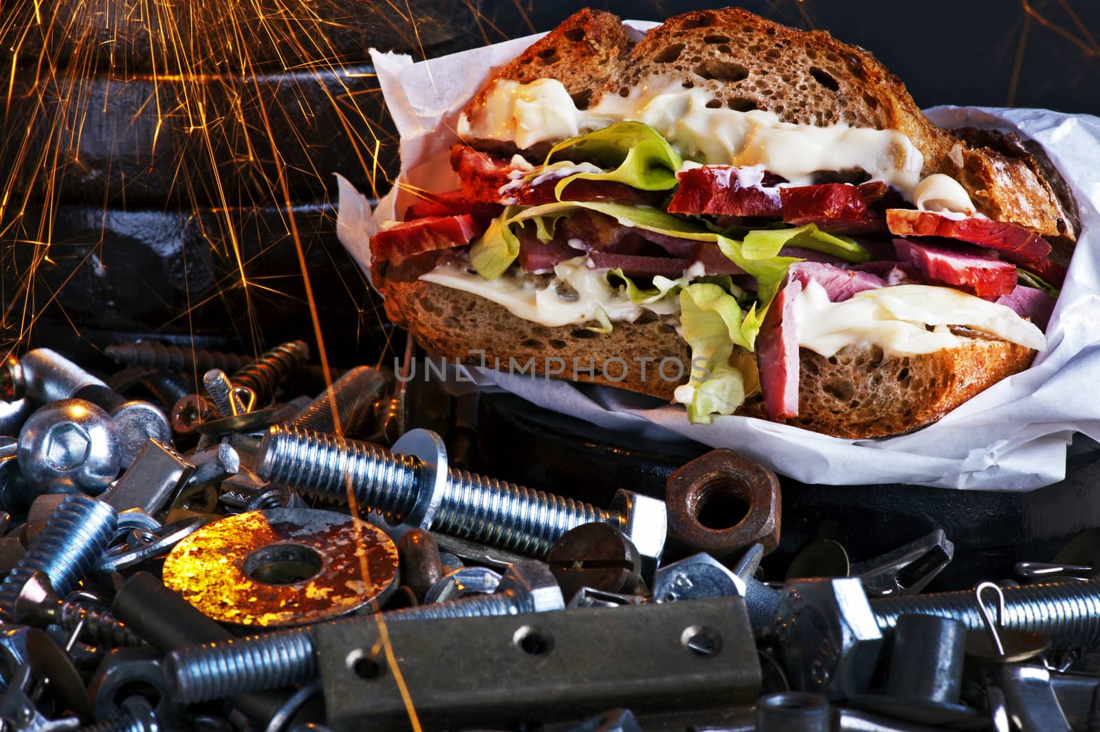 Sandwich with pork, lettuce and mayonnaise in a workshop scenery