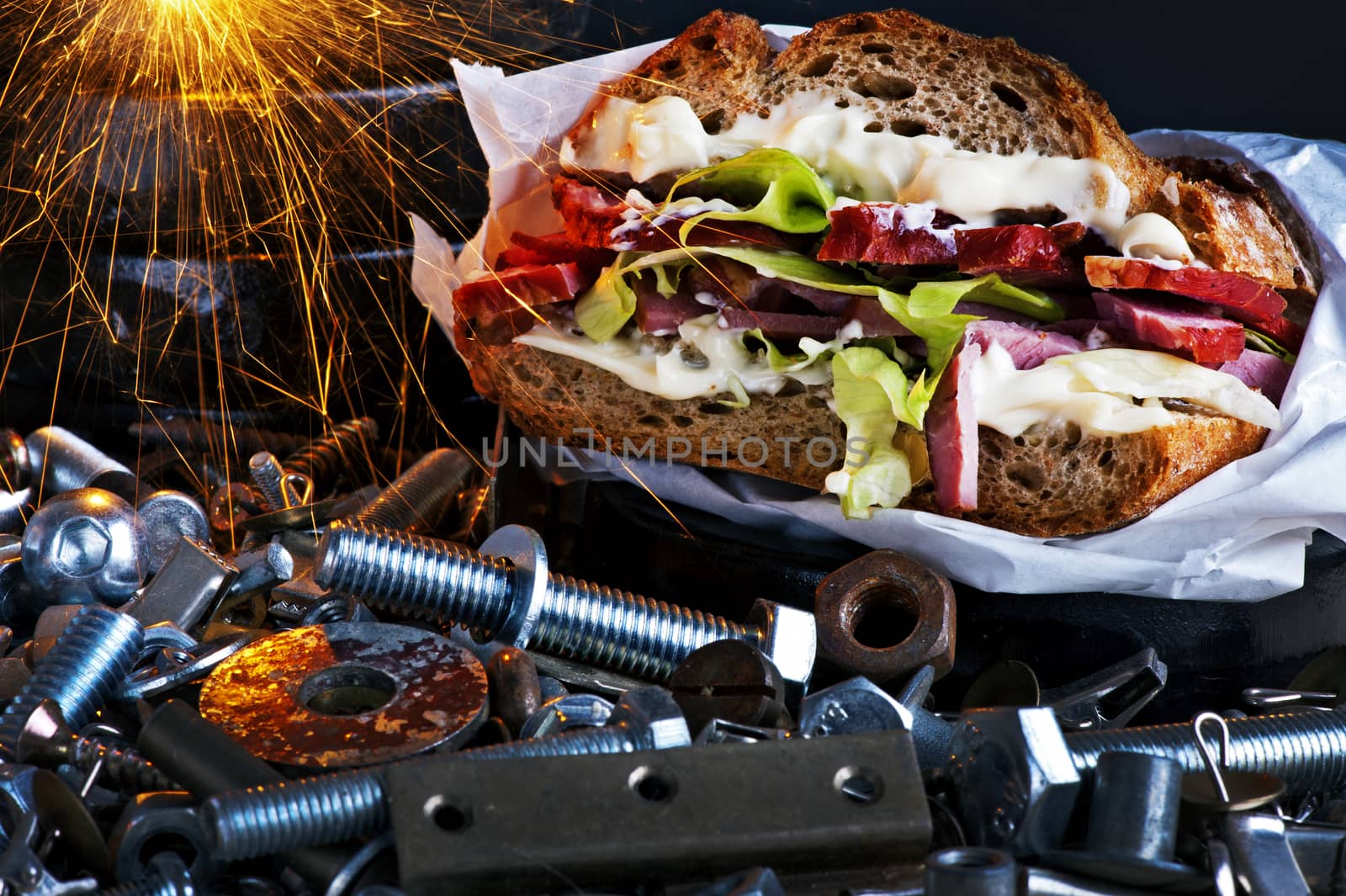 Sandwich with pork, lettuce and mayonnaise in a workshop scenery