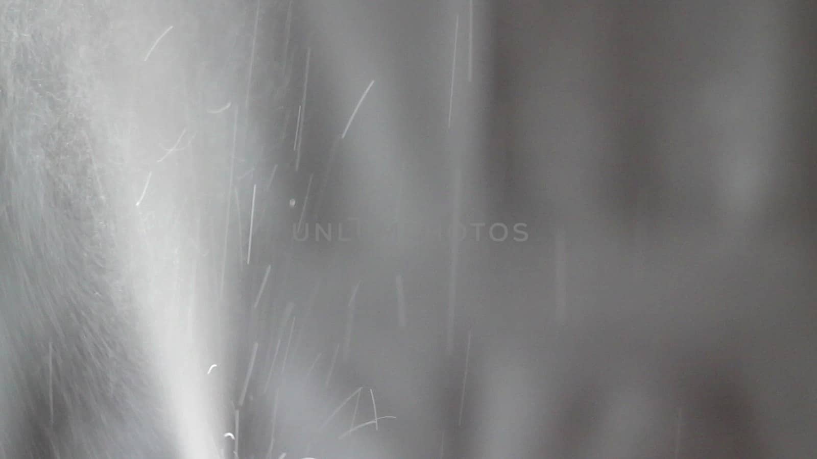 Aerosol can being sprayed against a grey background by nolimit046