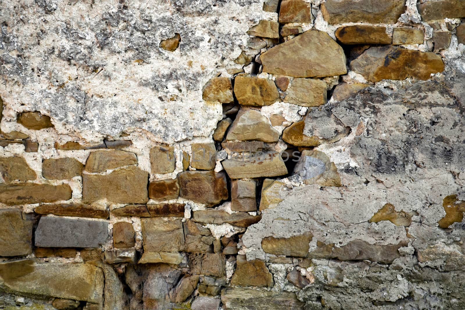 background detail stone wall with plaster subside