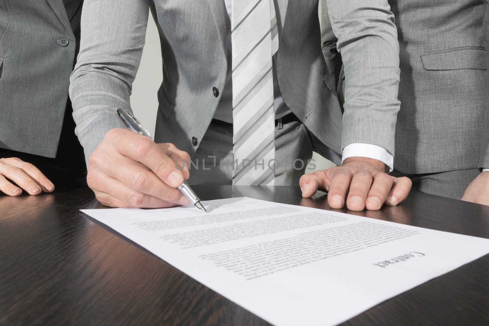 Business people sign contract by Yellowj