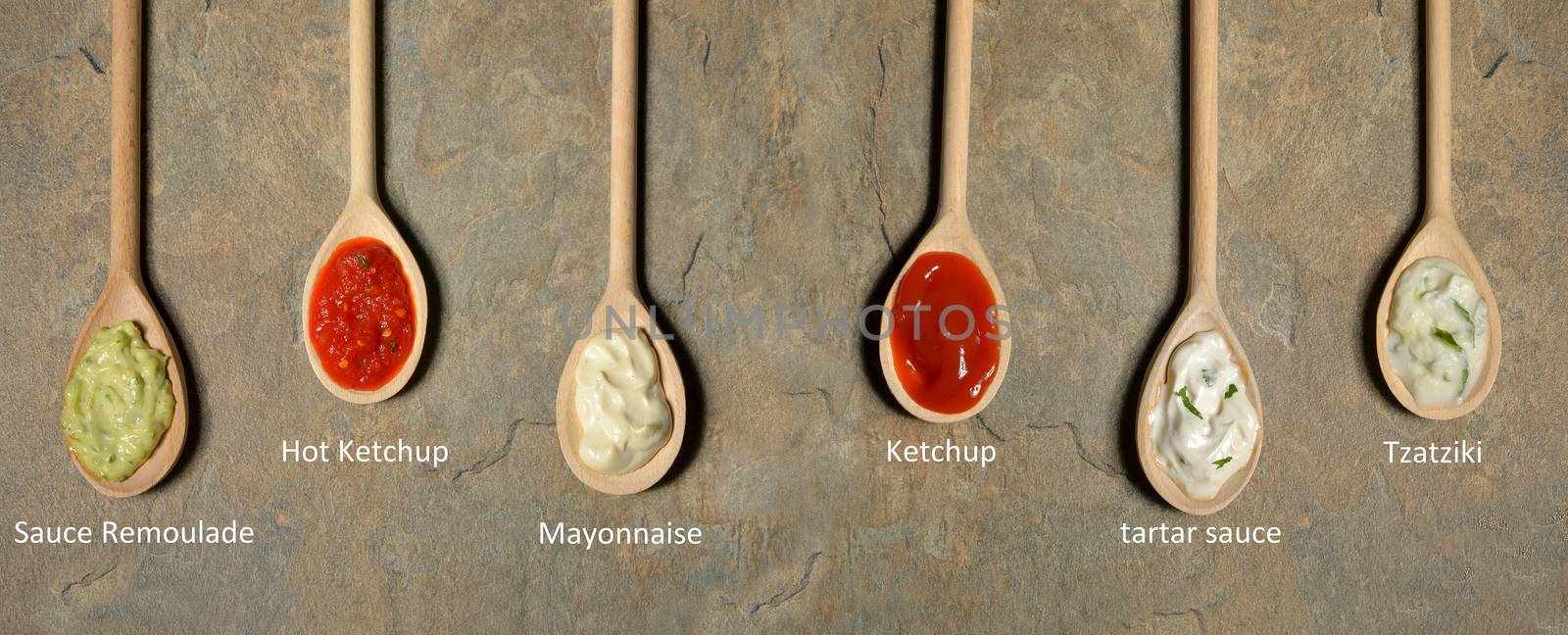 different types of sauces in spoons  by mady70