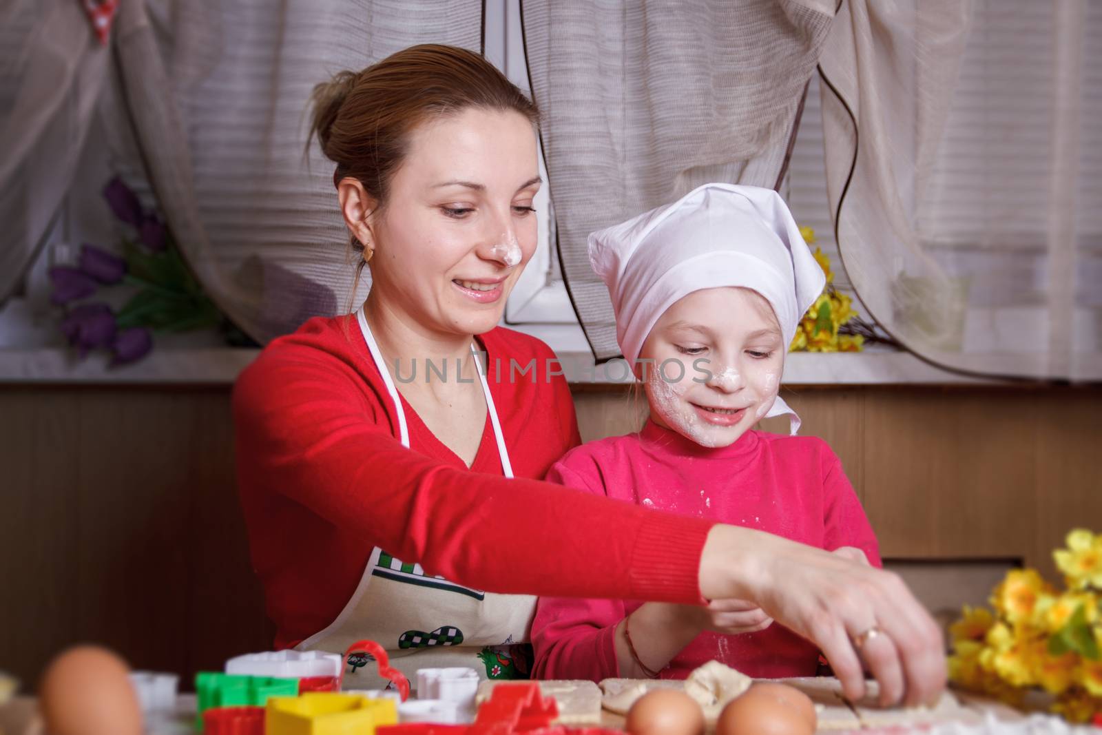 Mother and daughter rolling dough by Angel_a