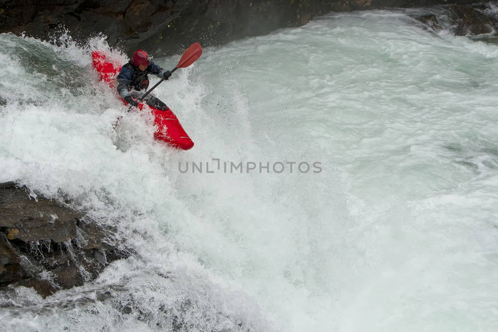 Kayaker in the waterfall in Norway, Ula river