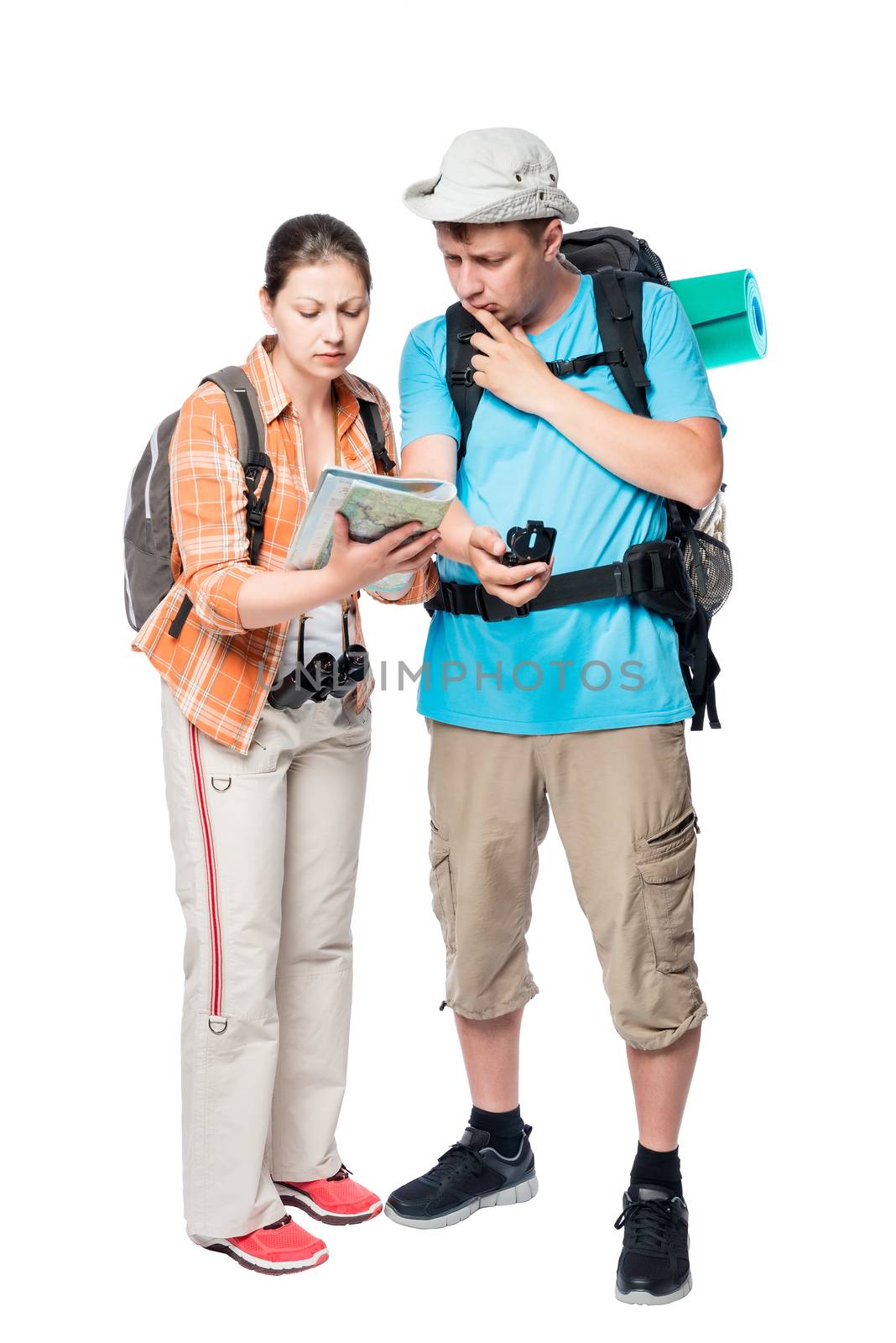 Young tourists got lost looking the road it on the map on a white background