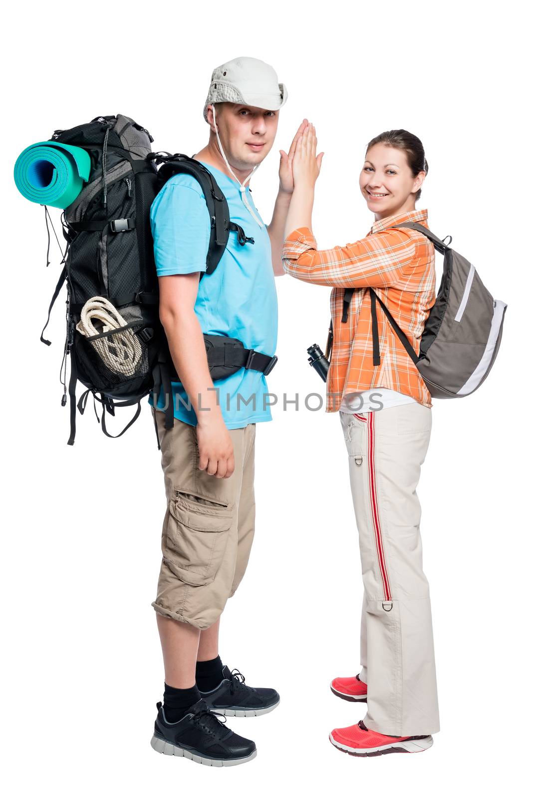 successful team of travelers with backpacks on a white background