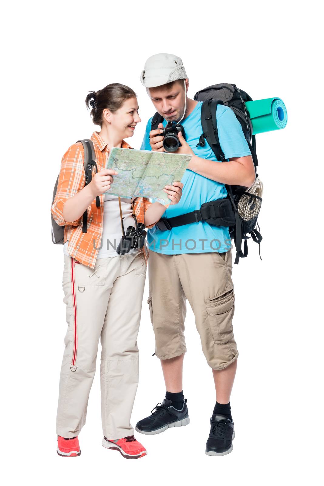 Portrait of happy travelers with a map and a camera on a white background