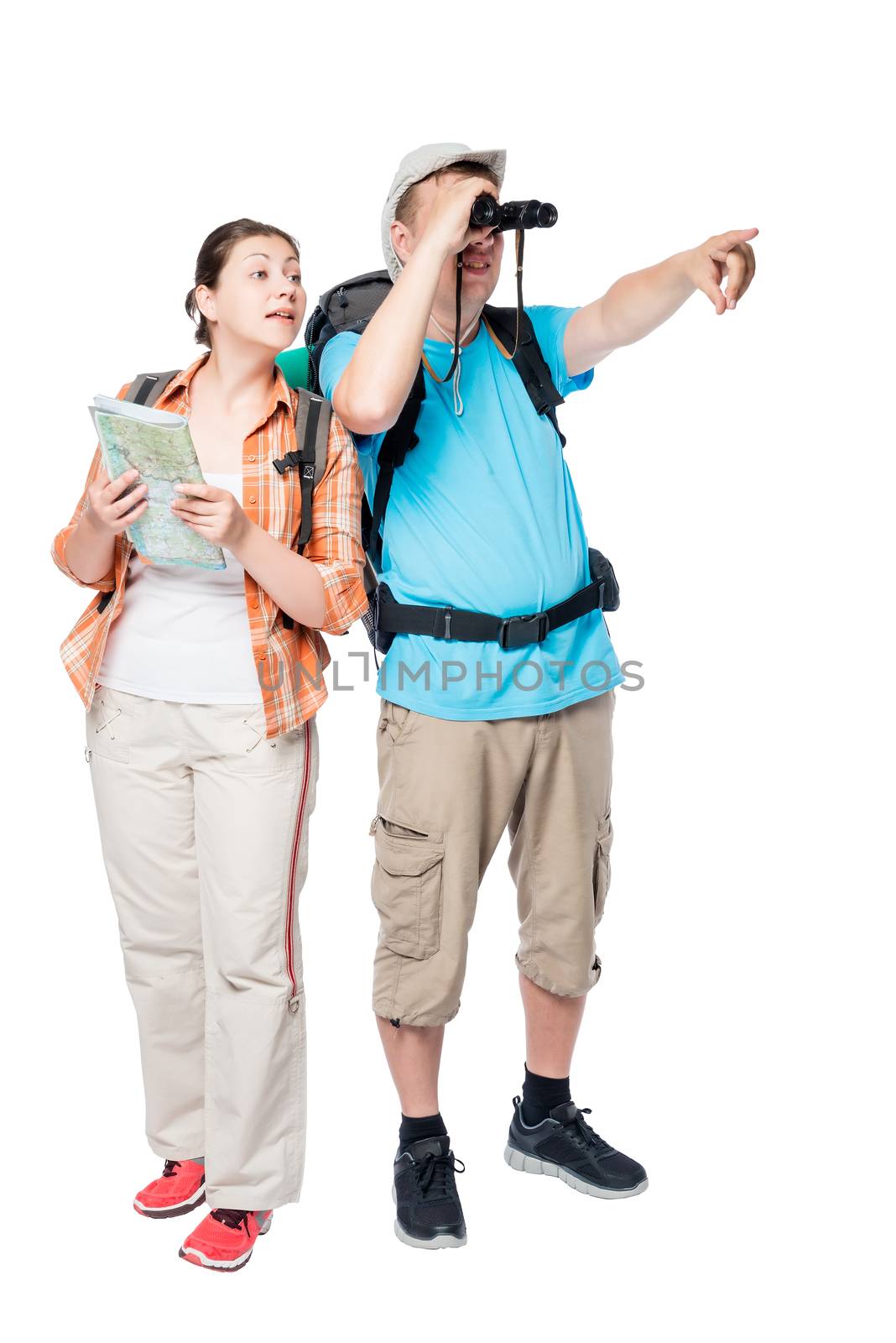 active young couple of travelers with backpacks go hiking on a white background