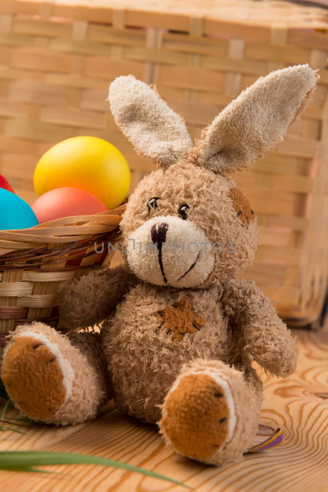 basket with colored eggs and the Easter Bunny for Easter by kosmsos111