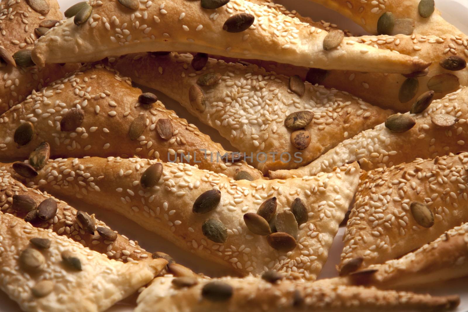 flaky Triangles  puff pastry Sprinkle Seeds pumpkin, sesame seeds, background