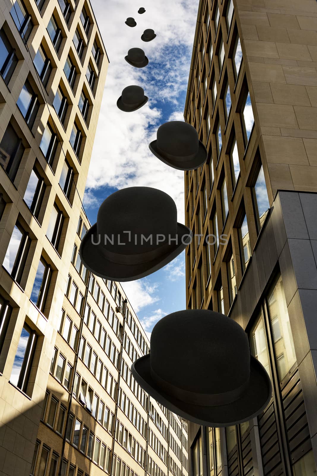Skyscraper with square windows and sky with clouds.