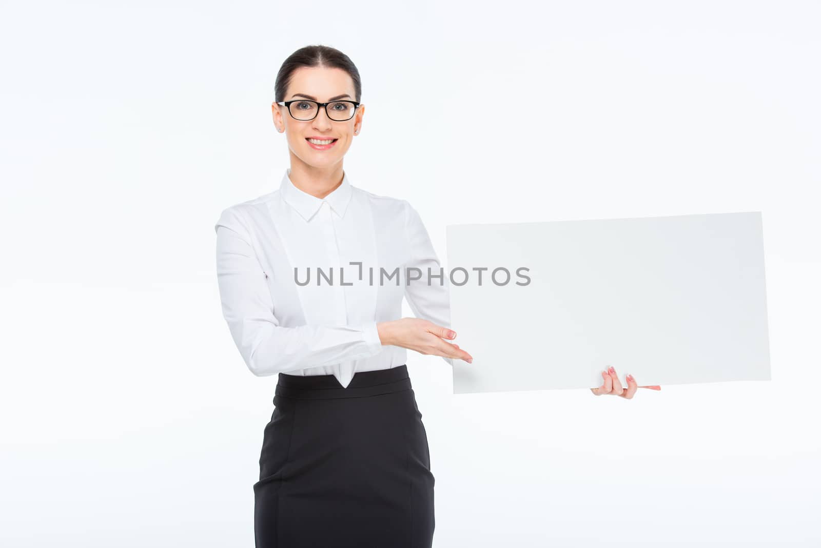 Businesswoman with blank card by LightFieldStudios