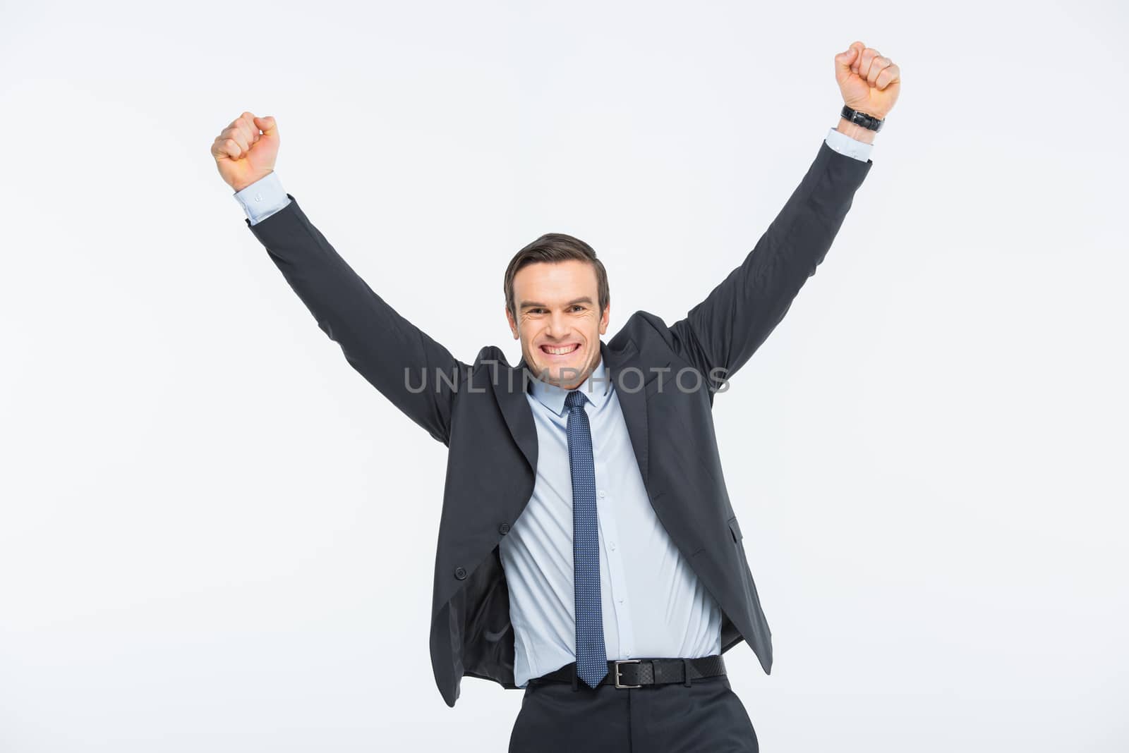 Young excited businessman by LightFieldStudios