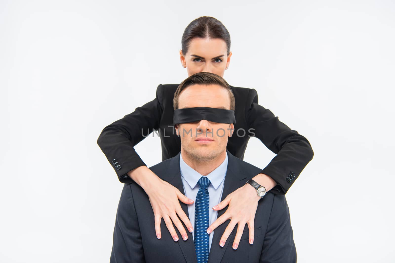 Businessman in blindfold and businesswoman by LightFieldStudios