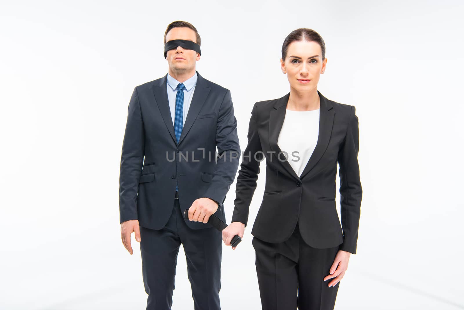 Businessman in blindfold and businesswoman by LightFieldStudios