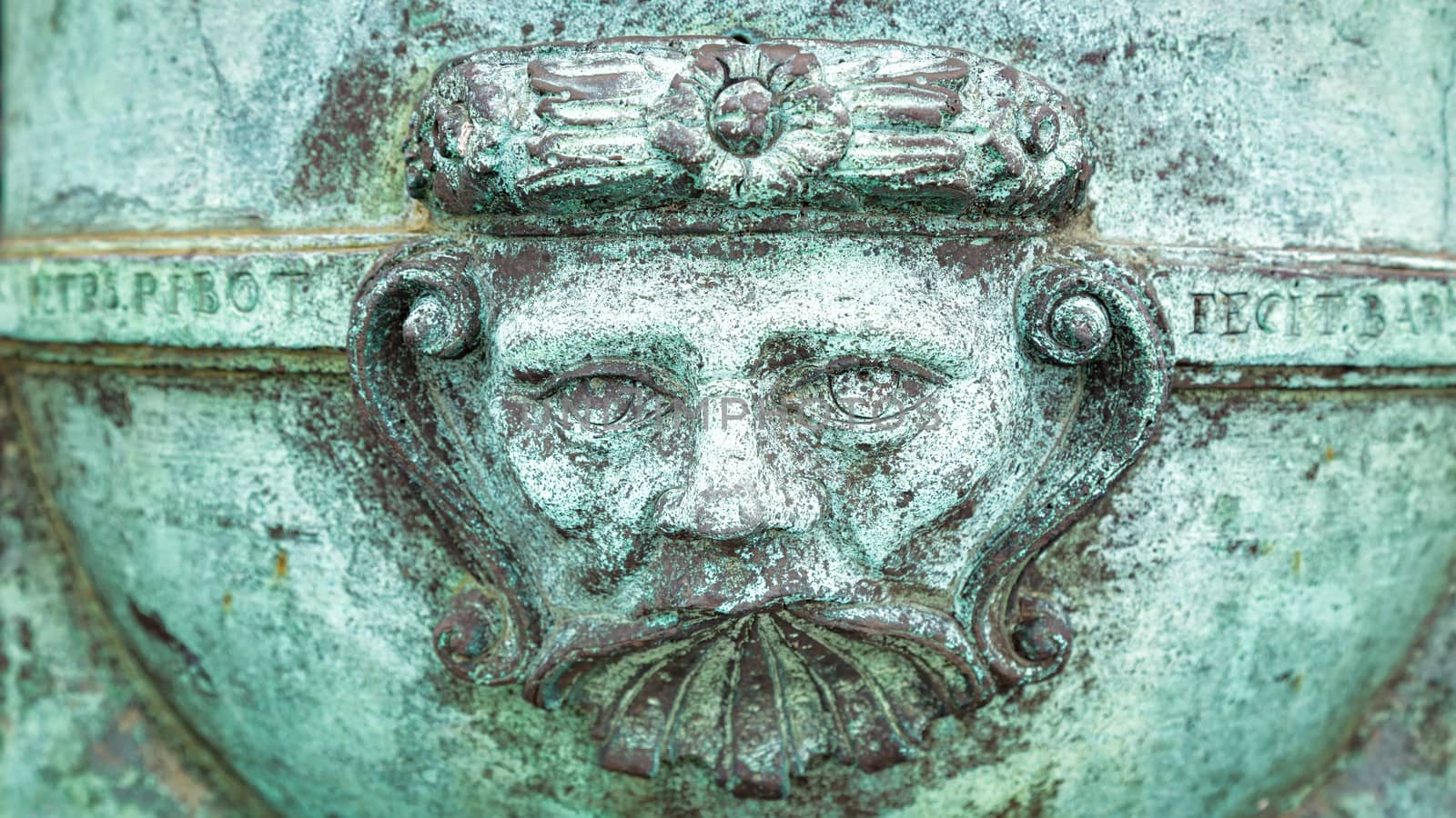 A Metal Face on an Old Cannon, Color Image, Day