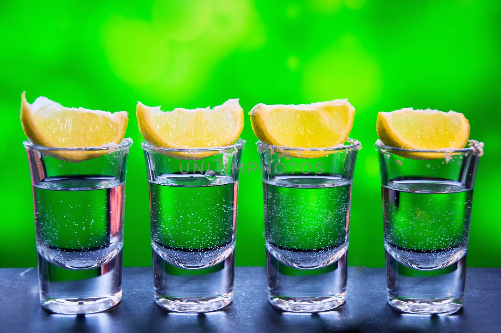 One Silver tequila shots with lime - Traditional Mexican drink