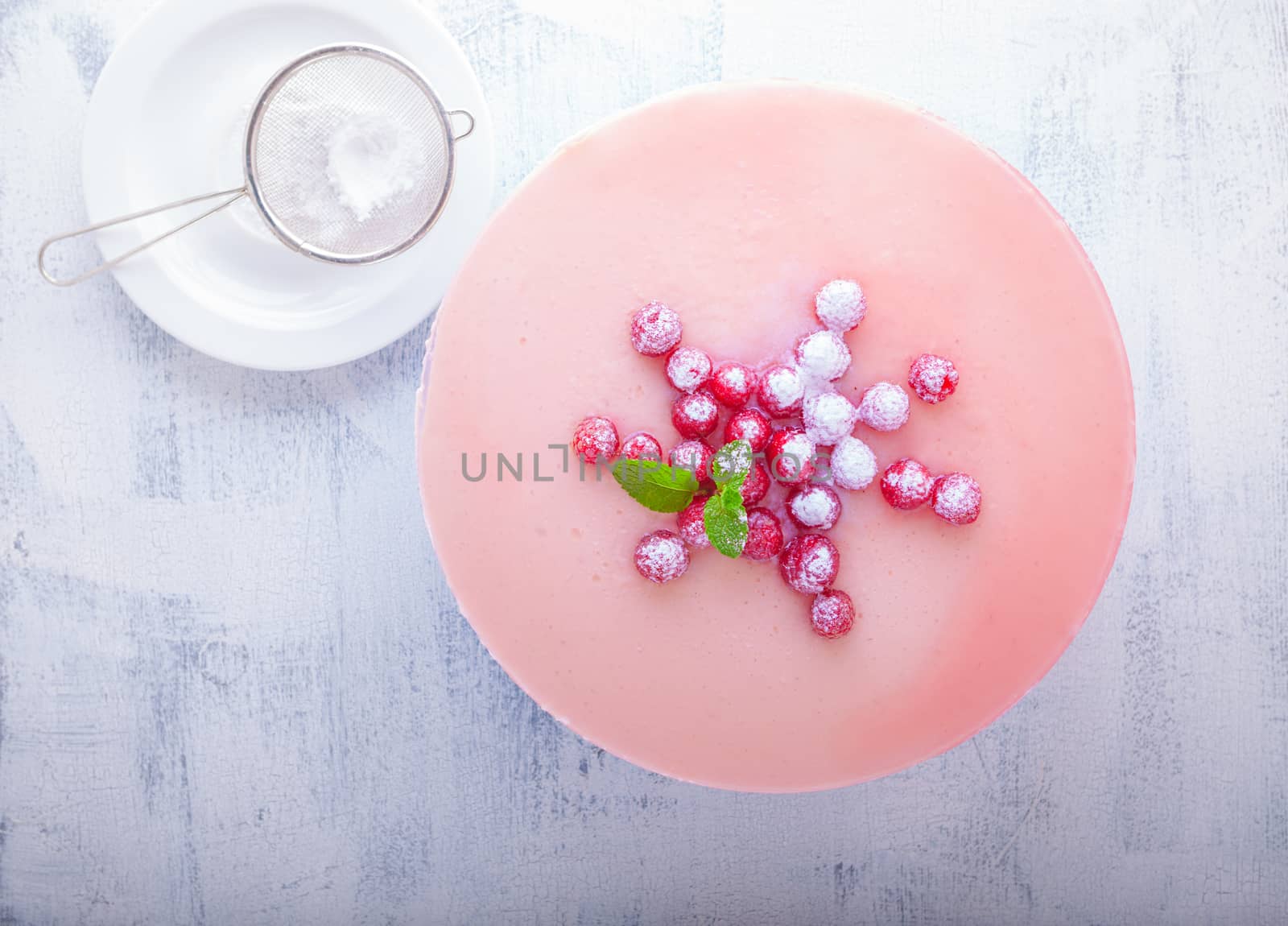 Raspberry yogurt cake with berries on a table