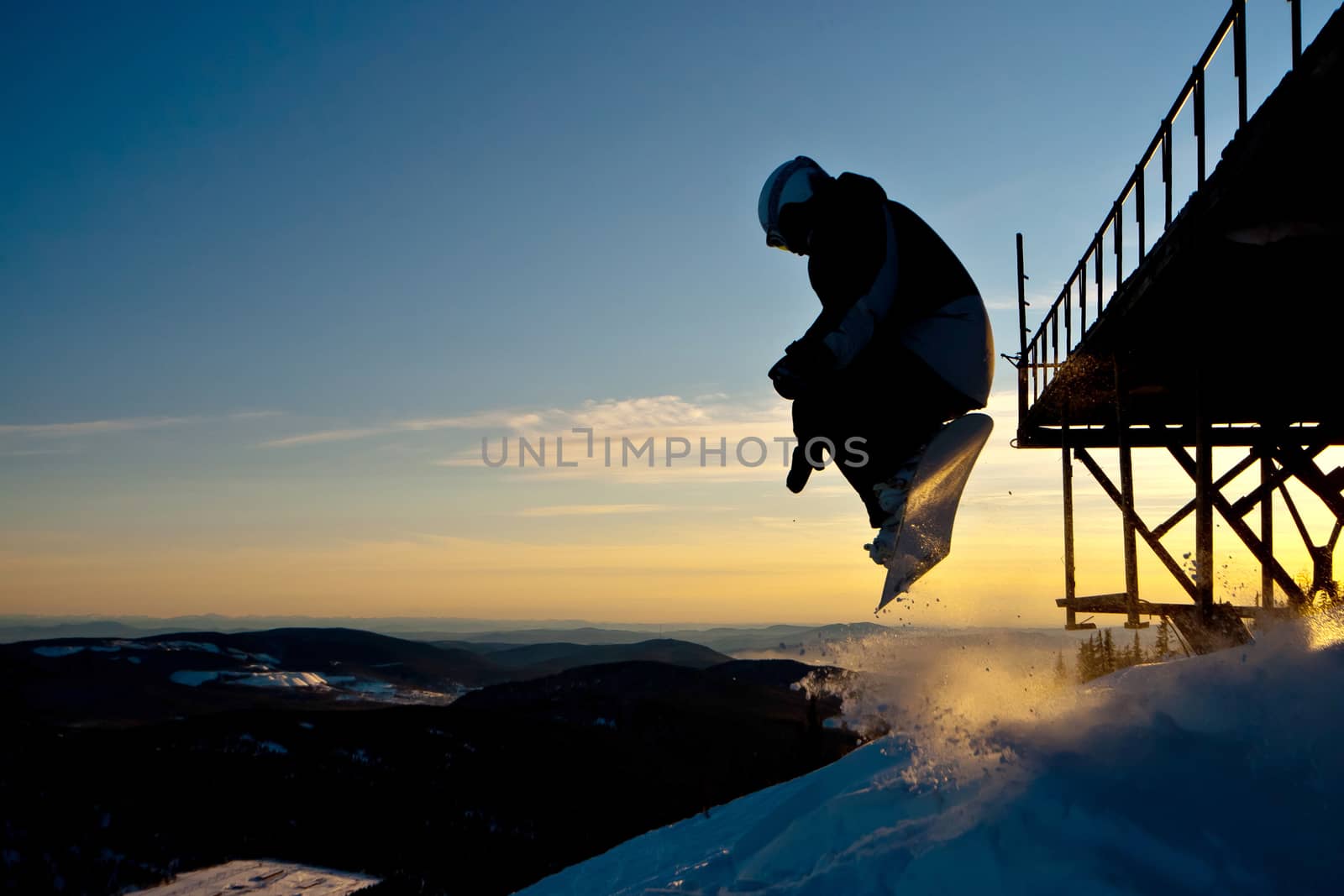The snowboarder jumping from the bridge in Siberia