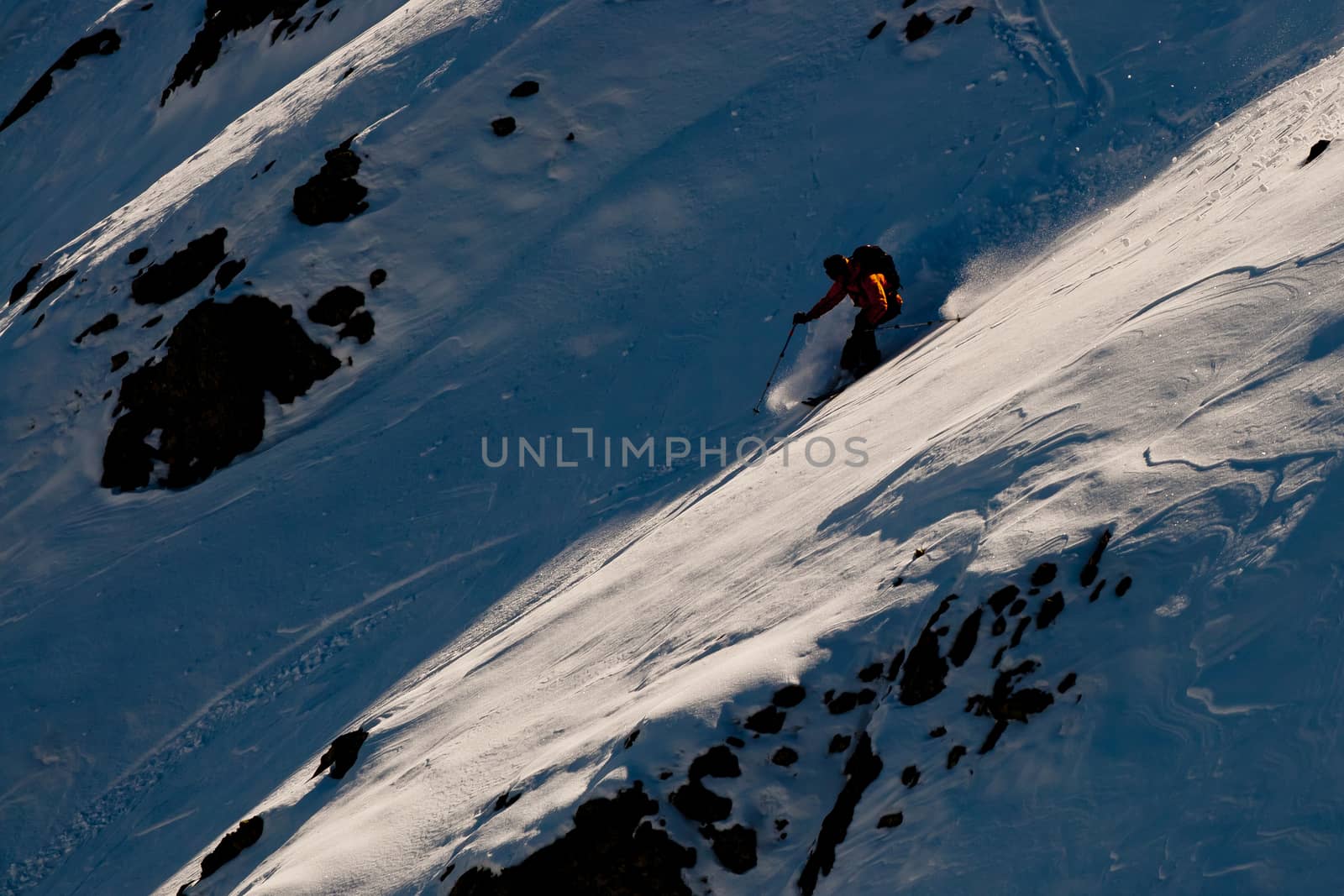 The young man skiing in the Caucasus mountains