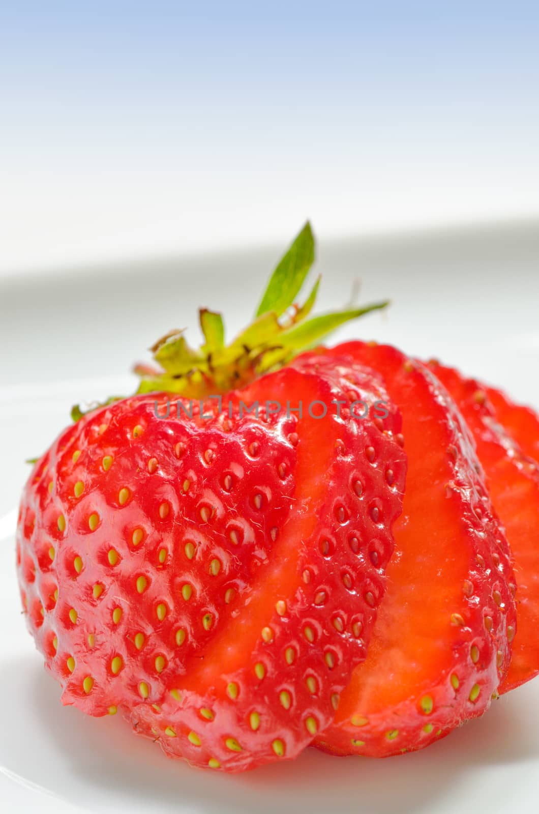 Strawberry slices cut on a white background