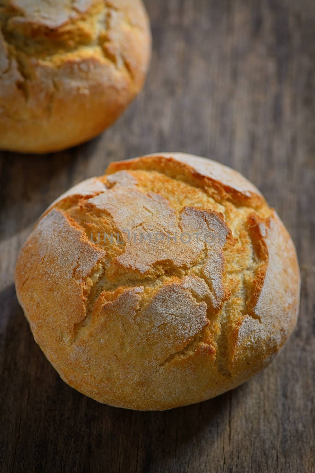 traditional homemade round bread on wooden table