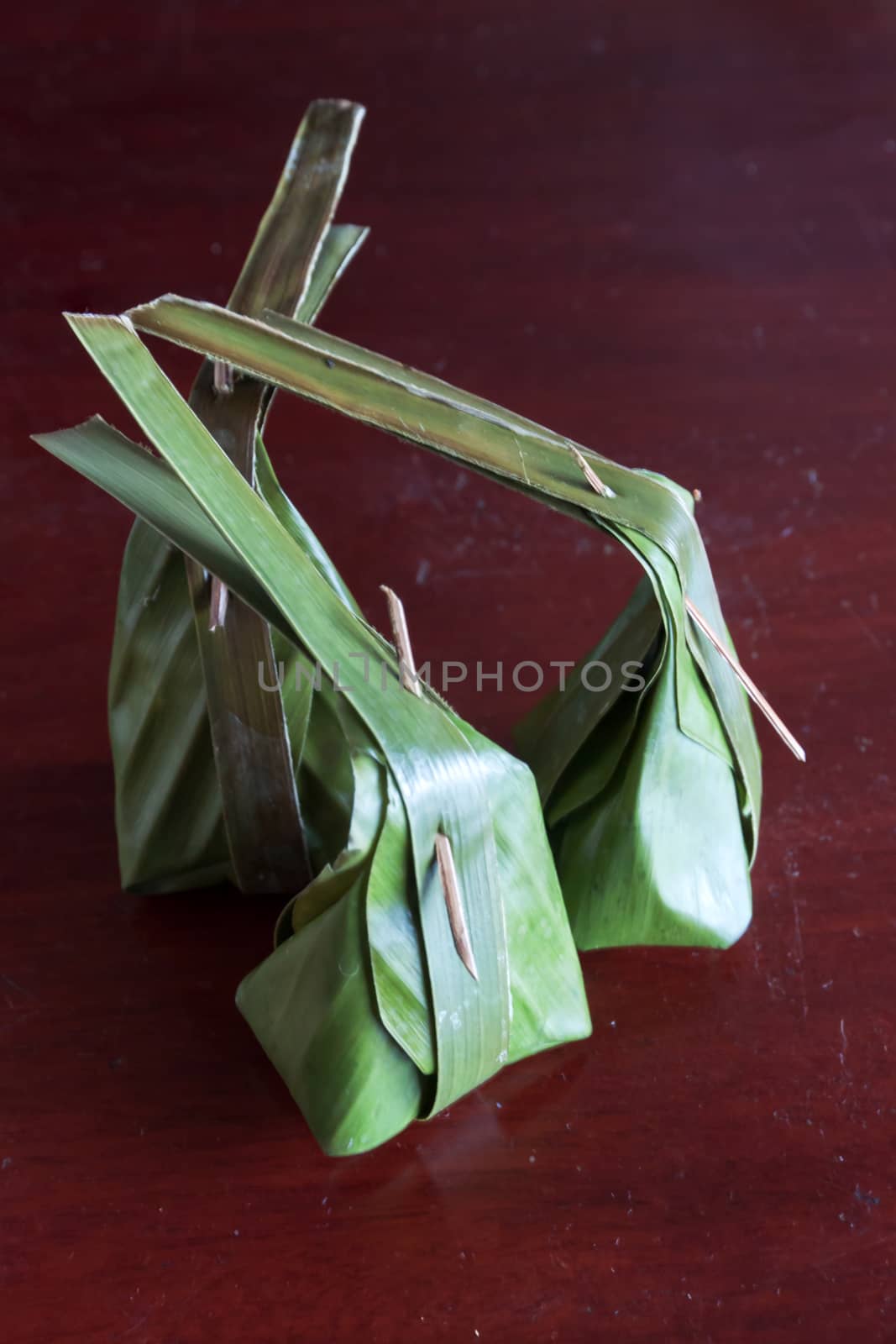Steamed Flour with Coconut Filling. Wrapped with banana leaf. Thai stuff traditional dessert.